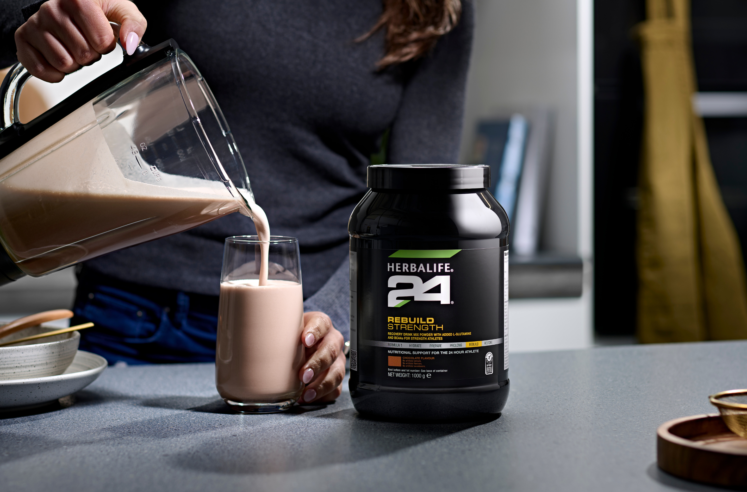 Herbalife 24 container on a table.